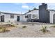 Charming single-story home with a black-and-white exterior, xeriscaping, and eye-catching curb appeal at 4629 Lilliput Ln, Las Vegas, NV 89102