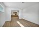 Bright living room with wood floors and a view of the kitchen at 4629 Lilliput Ln, Las Vegas, NV 89102