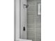 Modern shower stall featuring gray tile, a rainfall shower head, and sleek fixtures at 4629 Lilliput Ln, Las Vegas, NV 89102