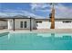 Beautiful pool and backyard features a covered patio and desert landscaping, creating a private oasis at 4629 Lilliput Ln, Las Vegas, NV 89102