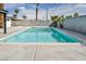 Refreshing backyard pool with clear blue water, perfect for swimming and enjoying the outdoors at 4629 Lilliput Ln, Las Vegas, NV 89102