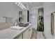 Cozy bathroom with stone countertop, decorative shower curtain and chrome fixtures at 4635 Bird View Ct, Las Vegas, NV 89129