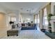 Inviting living room showcasing wood floors, a cozy seating area, fireplace and natural lighting at 4635 Bird View Ct, Las Vegas, NV 89129