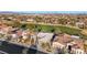 Overhead view of a residential area next to a golf course, showcasing well-maintained homes and desert landscaping at 4718 Atlantico St, Las Vegas, NV 89135