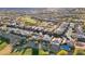 Aerial view of an expansive residential community with a golf course, desert landscaping, and mountain backdrop at 4718 Atlantico St, Las Vegas, NV 89135