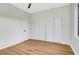 Bright bedroom featuring wood-look floors, a ceiling fan, and a spacious closet at 4718 Atlantico St, Las Vegas, NV 89135