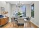 Dining room with a round table, gray chairs, decorative lighting, and modern decor at 4718 Atlantico St, Las Vegas, NV 89135