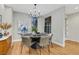 Dining room with a round table, gray chairs, decorative lighting, and modern decor at 4718 Atlantico St, Las Vegas, NV 89135