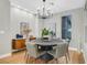 Dining room with a round table, gray chairs, decorative lighting, and modern decor at 4718 Atlantico St, Las Vegas, NV 89135