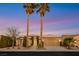 Beautiful home exterior with desert landscaping, mature palm trees, and a welcoming driveway at 4718 Atlantico St, Las Vegas, NV 89135