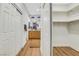 Hallway leads to a modern bathroom with double vanity and a closet with custom shelving at 4718 Atlantico St, Las Vegas, NV 89135