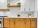 Close up of the modern kitchen showcasing wood cabinets, white countertops, and decorative shelves at 4718 Atlantico St, Las Vegas, NV 89135