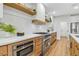 Modern kitchen with stainless steel stove, a built-in microwave, and wood cabinets at 4718 Atlantico St, Las Vegas, NV 89135