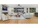 Bright living room featuring a ceiling fan, large windows, and comfortable seating at 4718 Atlantico St, Las Vegas, NV 89135