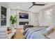 Relaxing main bedroom featuring a fireplace, TV, and cozy seating area at 4718 Atlantico St, Las Vegas, NV 89135