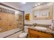 Full bathroom with tiled shower-tub combo and mosaic tile accent countertop at 4871 Reiter Ave, Las Vegas, NV 89108