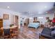 Spacious bedroom featuring a ceiling fan, wood flooring, and ample natural light at 4871 Reiter Ave, Las Vegas, NV 89108