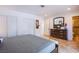 Bedroom featuring tile flooring, a comfortable bed, and access to the bathroom at 4871 Reiter Ave, Las Vegas, NV 89108