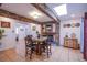 Charming dining room with stone accents, skylight, and tile flooring at 4871 Reiter Ave, Las Vegas, NV 89108