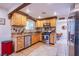 Well-equipped kitchen featuring wood cabinets, stainless steel appliances, and ample counter space at 4871 Reiter Ave, Las Vegas, NV 89108