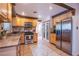 Modern kitchen with stainless steel appliances, light wood cabinetry, and an efficient layout at 4871 Reiter Ave, Las Vegas, NV 89108