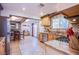 Spacious kitchen featuring light wood cabinets, stainless steel appliances, and access to the dining area at 4871 Reiter Ave, Las Vegas, NV 89108