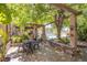 Charming outdoor patio with stone accents and ample seating, perfect for relaxing or entertaining at 4871 Reiter Ave, Las Vegas, NV 89108