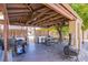 Spacious covered patio with grill, outdoor seating, and inviting fire pit at 4871 Reiter Ave, Las Vegas, NV 89108