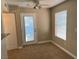 Cozy dining area with natural light, ceiling fan and access door offers comfortable and convenient meal space at 5055 W Hacienda Ave # 1028, Las Vegas, NV 89118