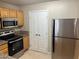 Efficient kitchen design features stainless steel appliances, granite countertops, and ample cabinet space for cooking at 5055 W Hacienda Ave # 1028, Las Vegas, NV 89118