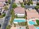 Aerial view of a property featuring a large pool, manicured lawns, and a private backyard oasis at 5271 Villa Vecchio Ct, Las Vegas, NV 89141