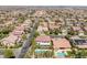 Residential aerial featuring tile roofs, swimming pools, and lush landscaping in a suburban community at 5271 Villa Vecchio Ct, Las Vegas, NV 89141