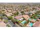 Neighborhood aerial showing tile roofs, swimming pools, and mature landscaping in a suburban community at 5271 Villa Vecchio Ct, Las Vegas, NV 89141