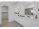 Bathroom vanity with and illuminated mirrors and modern fixtures at 5271 Villa Vecchio Ct, Las Vegas, NV 89141