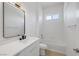 Bright bathroom featuring a white vanity, tub shower, and modern fixtures at 5271 Villa Vecchio Ct, Las Vegas, NV 89141