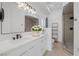 Stylish bathroom featuring a white quartz countertop and a glass-enclosed shower at 5271 Villa Vecchio Ct, Las Vegas, NV 89141