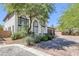 Charming two-story home featuring an arched entryway, manicured landscaping, and a spacious driveway at 5271 Villa Vecchio Ct, Las Vegas, NV 89141