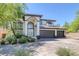 Elegant two-story home with a three-car garage and manicured front yard at 5271 Villa Vecchio Ct, Las Vegas, NV 89141