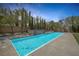 A stunning backyard pool with a unique waterfall feature and serene ambiance at 5271 Villa Vecchio Ct, Las Vegas, NV 89141