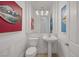 Chic powder room featuring modern fixtures and bold artwork at 5271 Villa Vecchio Ct, Las Vegas, NV 89141