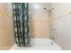 Clean bathroom featuring a shower and tub combination, accented by mosaic tile at 5385 Ravendale Cir, Las Vegas, NV 89120