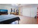 Bedroom featuring tiled flooring, a closet with sliding doors, and modern decor at 5385 Ravendale Cir, Las Vegas, NV 89120