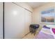 Bedroom featuring a closet with sliding doors and a window that provide natural light at 5385 Ravendale Cir, Las Vegas, NV 89120