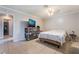 Bedroom with tile floors and a modern entertainment center with a large television at 5385 Ravendale Cir, Las Vegas, NV 89120