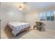 Cozy bedroom with natural light and minimalist design, featuring tile floors at 5385 Ravendale Cir, Las Vegas, NV 89120