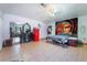 Bedroom featuring tiled flooring, a closet with sliding doors, and a large mural at 5385 Ravendale Cir, Las Vegas, NV 89120