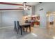 Bright dining area featuring tile floors and a view of the kitchen with recessed lighting at 5385 Ravendale Cir, Las Vegas, NV 89120