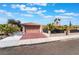 Attractive home with a desert landscape and large driveway with a two car garage at 5385 Ravendale Cir, Las Vegas, NV 89120