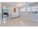 Large flex room featuring tile floors, plantation shutters, a white piano, and an open floor plan at 5385 Ravendale Cir, Las Vegas, NV 89120