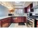 Bright kitchen featuring stainless steel appliances and modern lighting fixtures at 5385 Ravendale Cir, Las Vegas, NV 89120